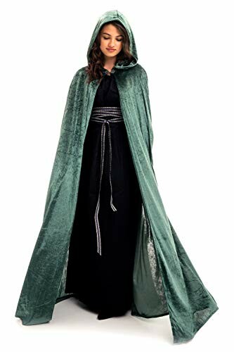 Woman wearing a long green velvet hooded cape