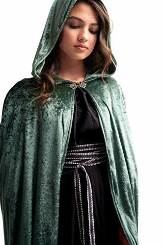 Woman wearing a green velvet hooded cape.